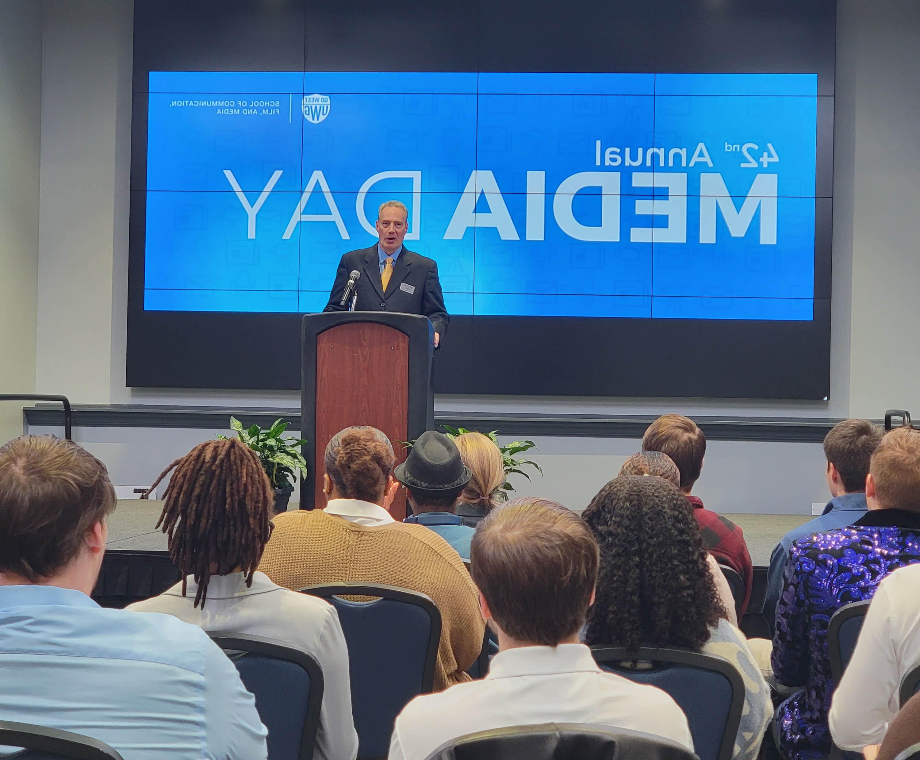 Dr. Yates speaking at Media Day kickoff event